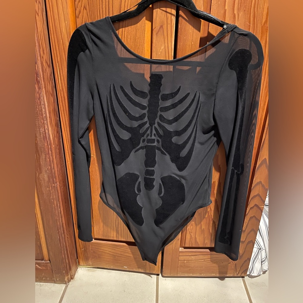 Women’s sheer bodysuit with skeleton appliqué